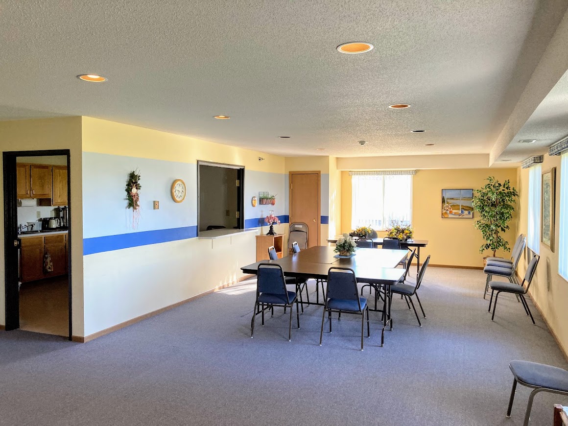 A dining room with a table set for six.