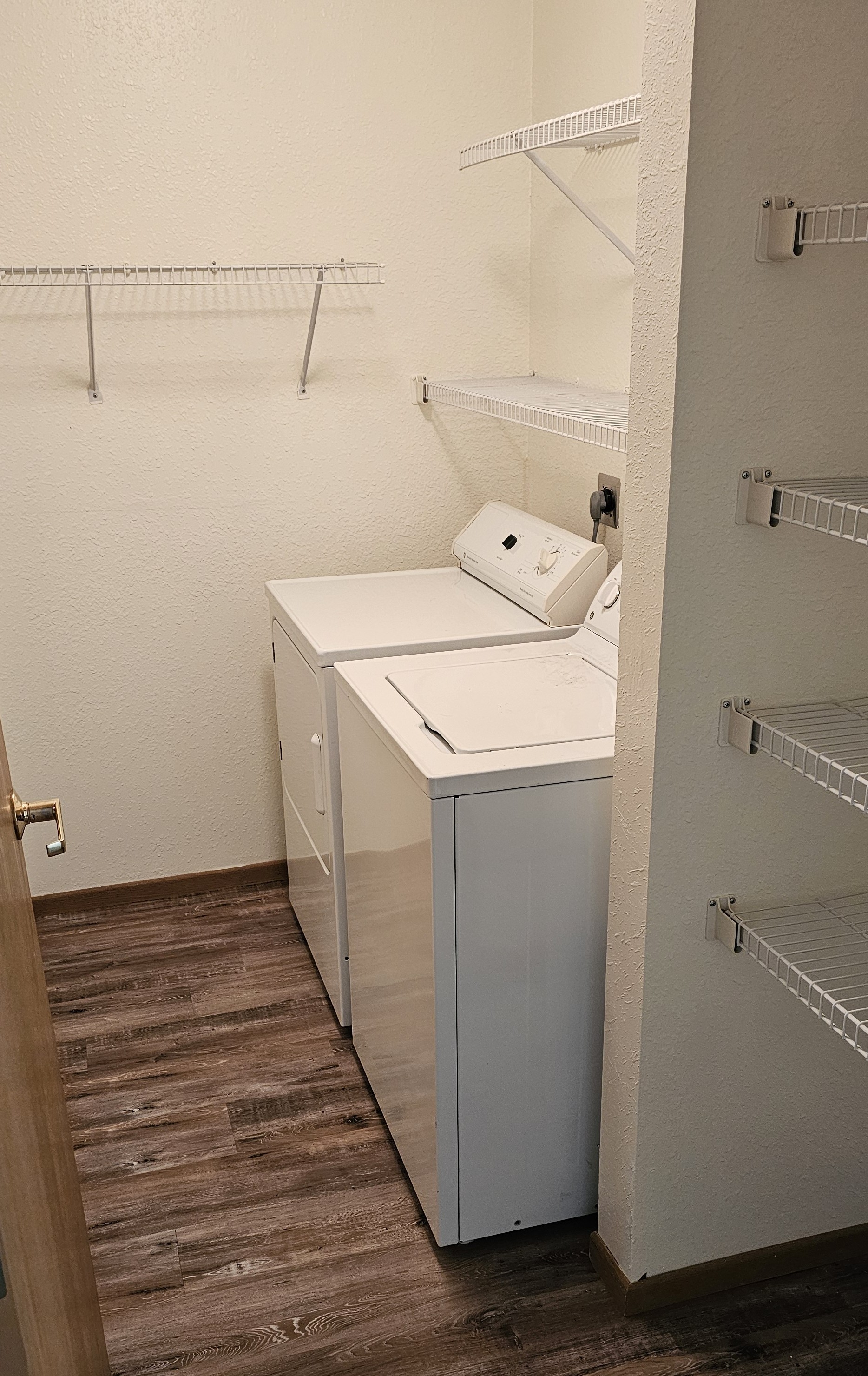 A white cabinet with a white drawer and a white box on top of it.