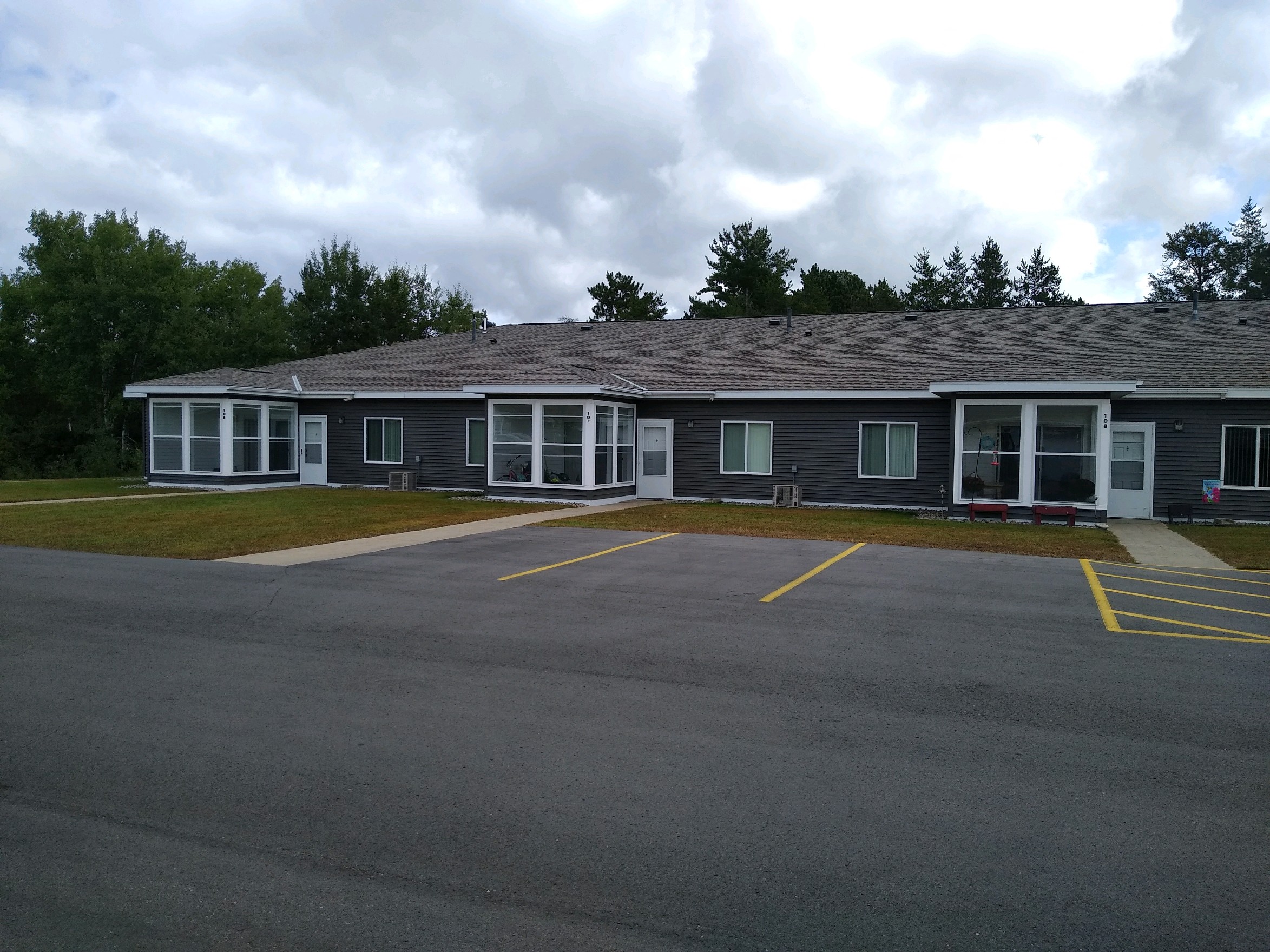 a large building with a parking lot in front of it
