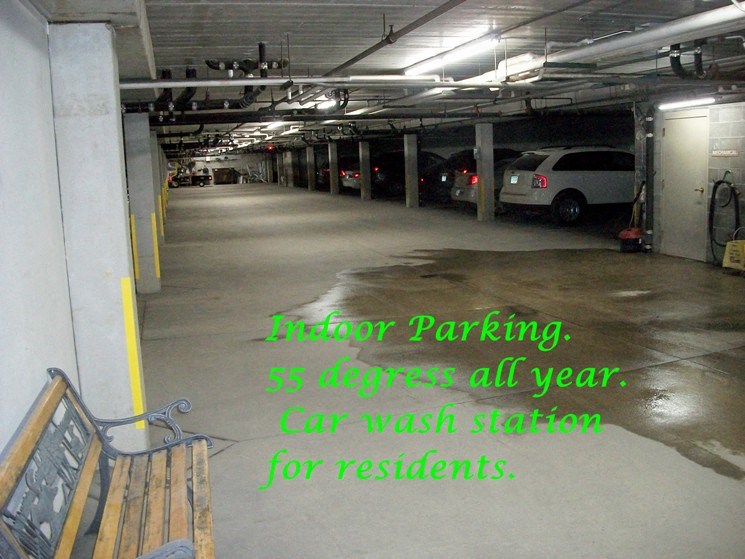 an empty parking garage with a bench in it