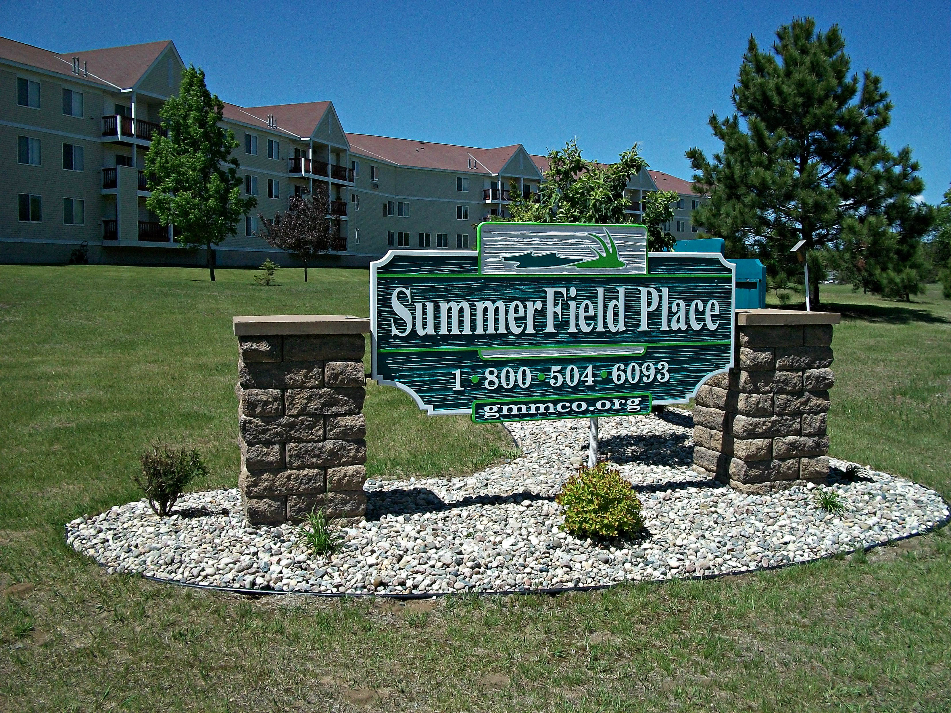 the sign for summerfield place in front of an apartment building