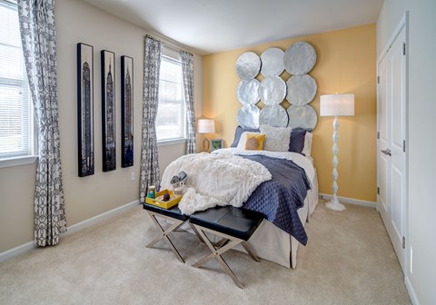 a bedroom with a bed and a table