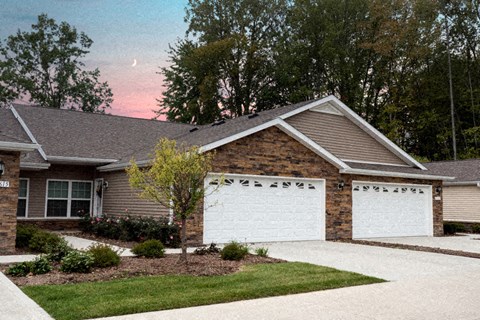 A house with a white garage door and a driveway.