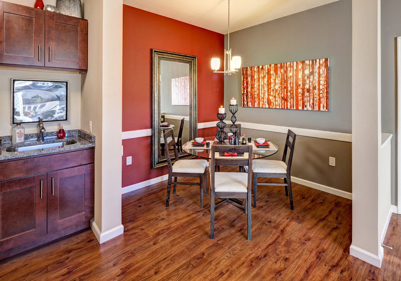 a dining room with a table and chairs