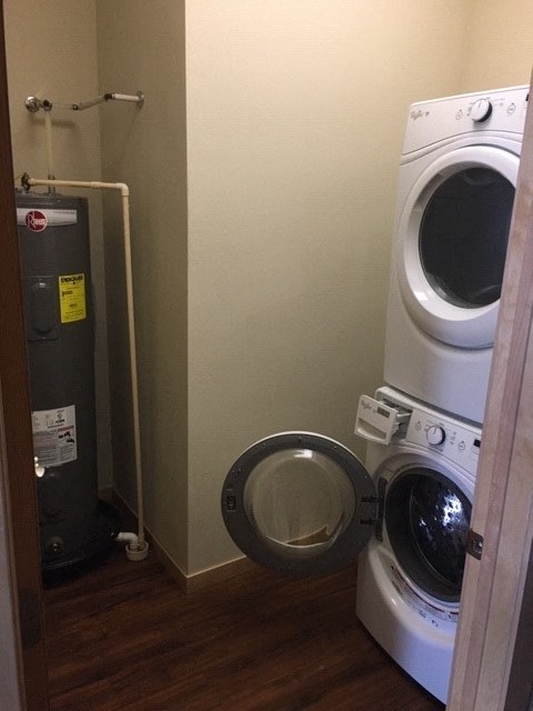 a small bathroom with a toilet and a washing machine