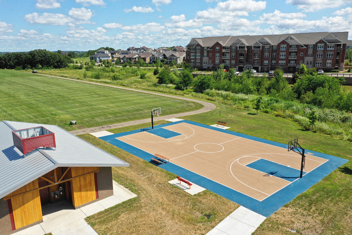an aerial view of a basketball court with a building in the background