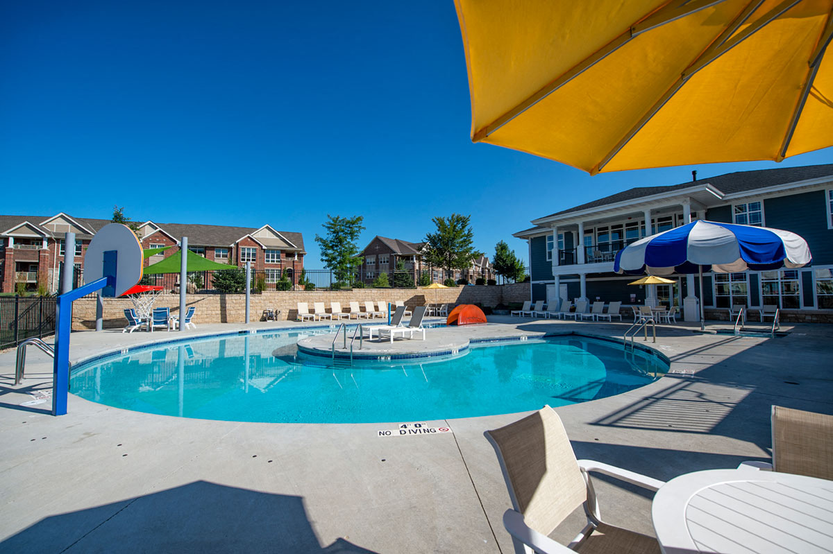 our apartments have a large swimming pool with umbrellas