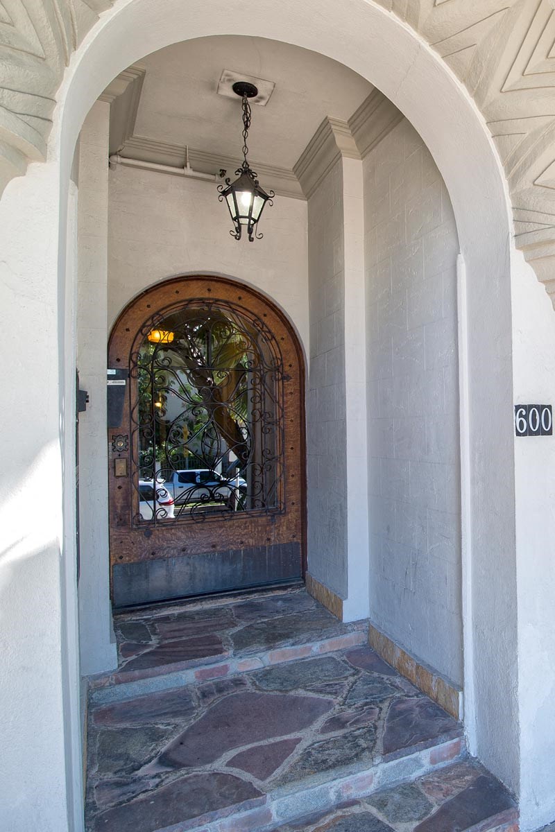 the front door of a building with an arched door