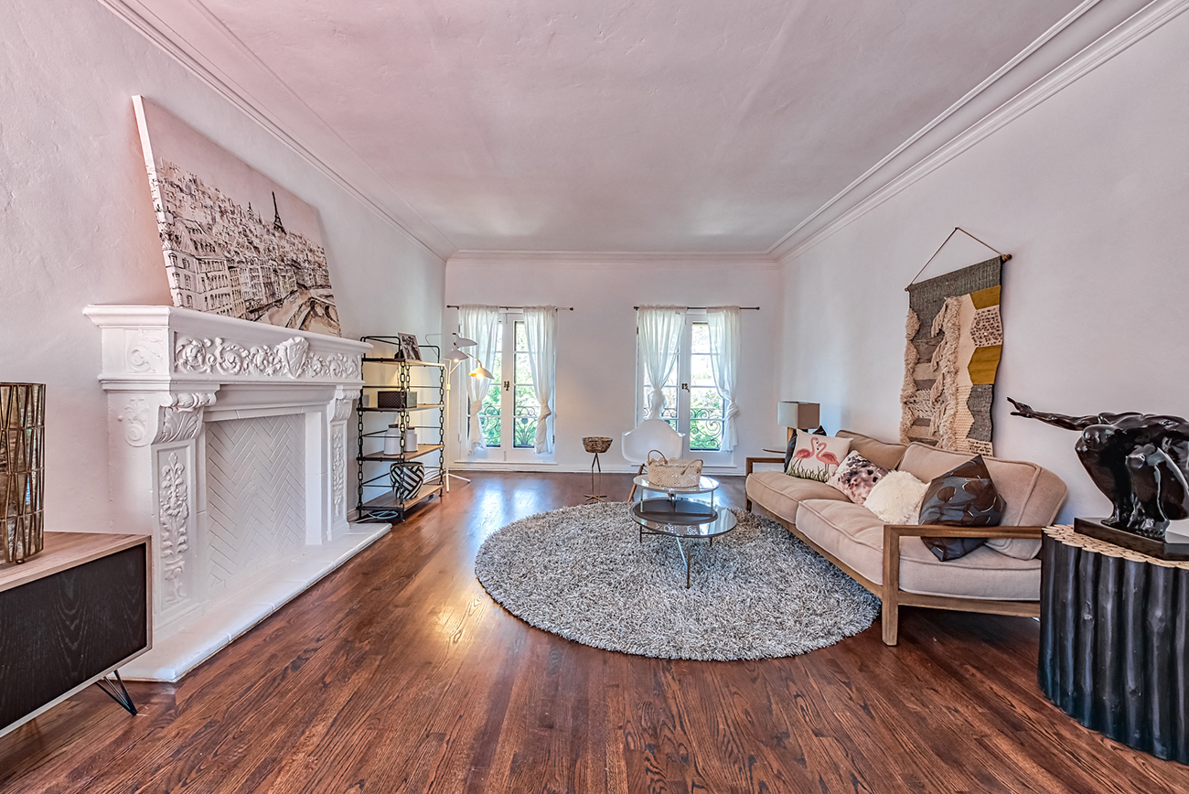 a living room with a couch and a fireplace