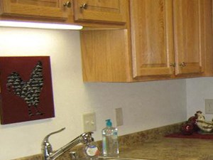 Interiors Gourmet Kitchens with Islands, Caesarstone Countertops, and Decorative Backsplash at Highlands at River Crossing Apartments, Winneconne, WI