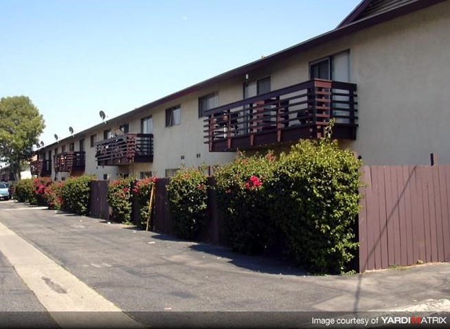 a row of houses with wooden balconies