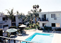 a large swimming pool in front of a building