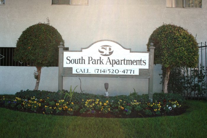 a sign apartments in front of a building
