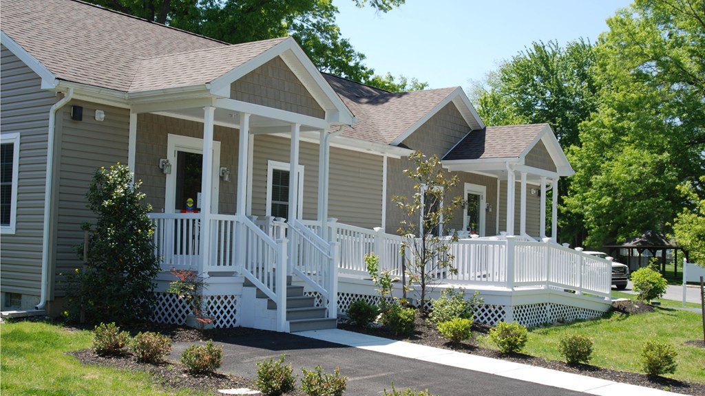a house with a porch and a porch swing
