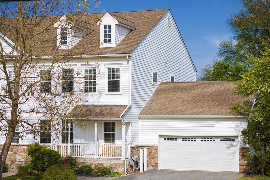 a white house with a white garage door