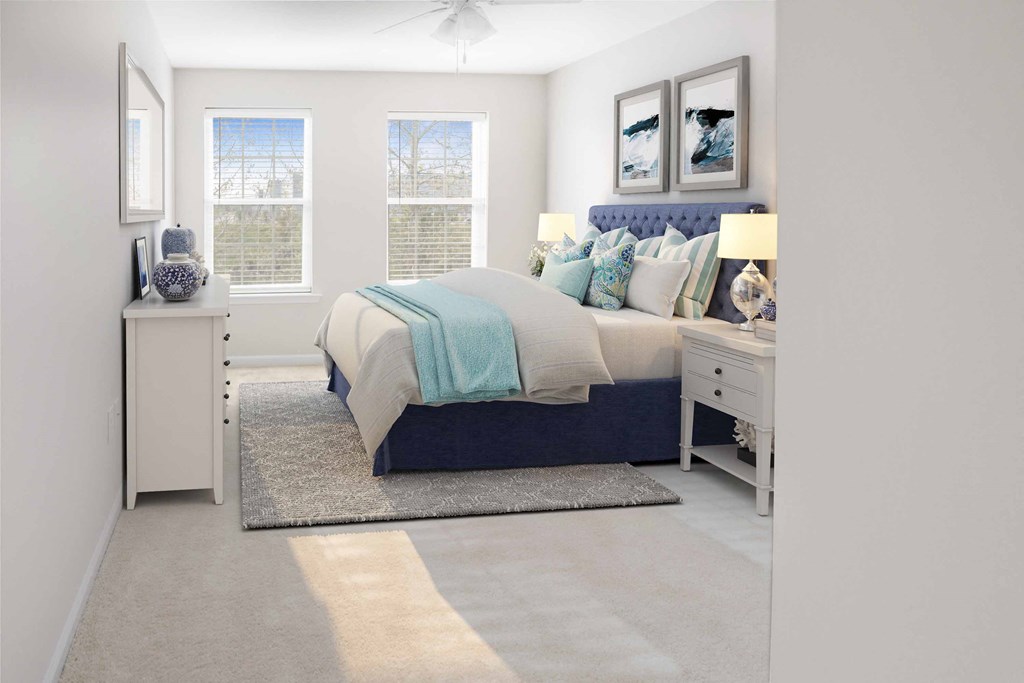 a bedroom with a bed and two windows