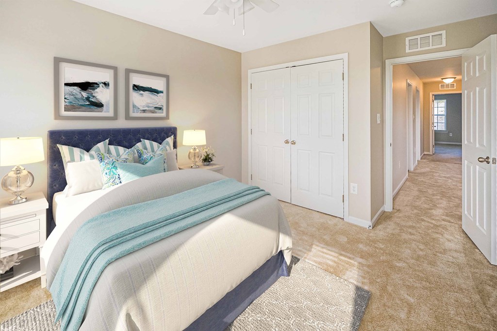 a bedroom with a bed and a closet