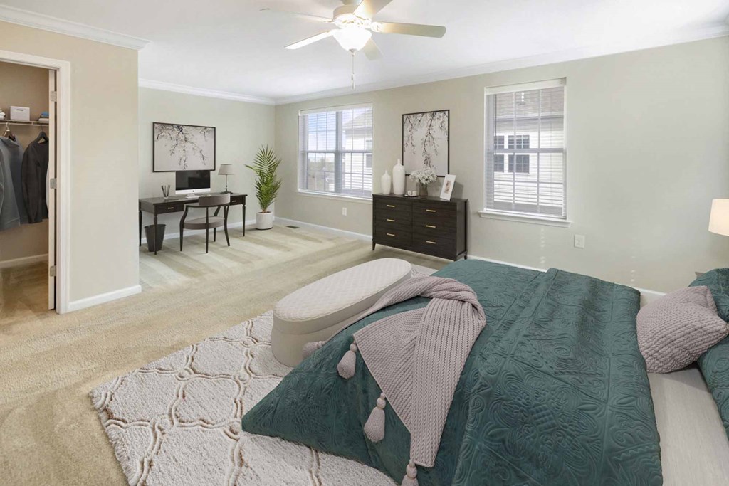 a bedroom with a bed and a desk