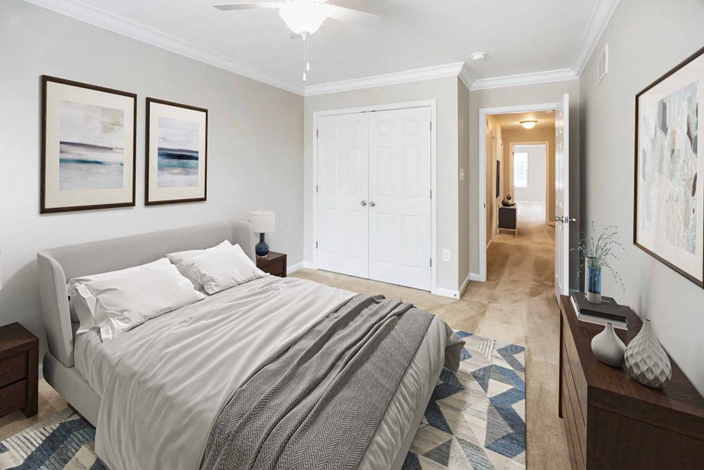 a bedroom with a bed and a hallway with a closet