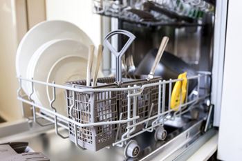 a dishwasher filled with dishes and utensils at Boulder Pointe Apartments in Middletown, NY 10940