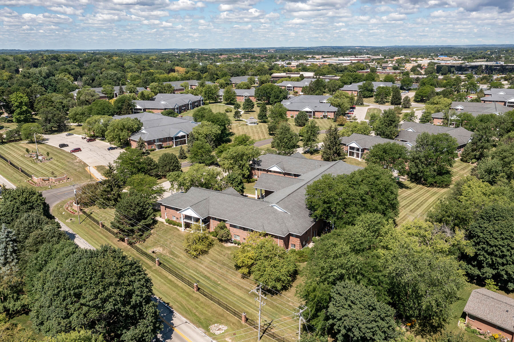 an aerial view of a neighborhood with houses and trees