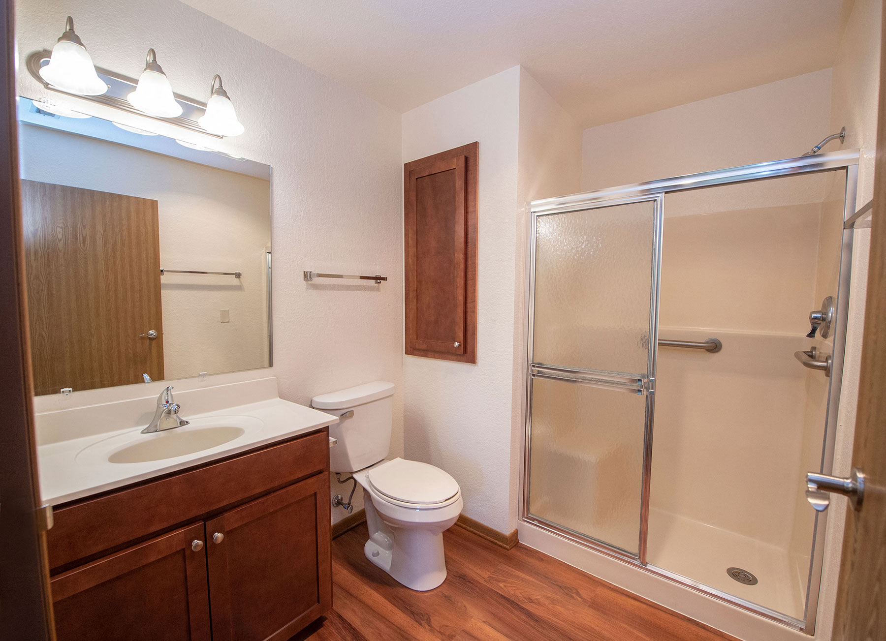 a bathroom with a shower toilet and sink
