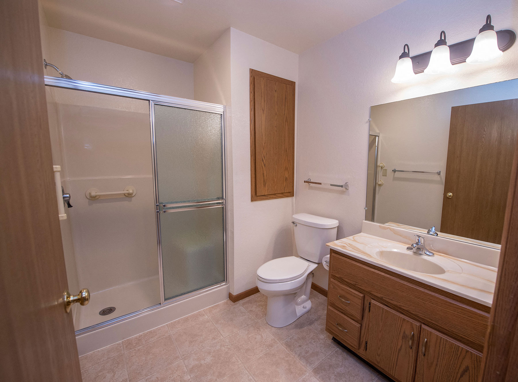 a bathroom with a shower toilet and sink