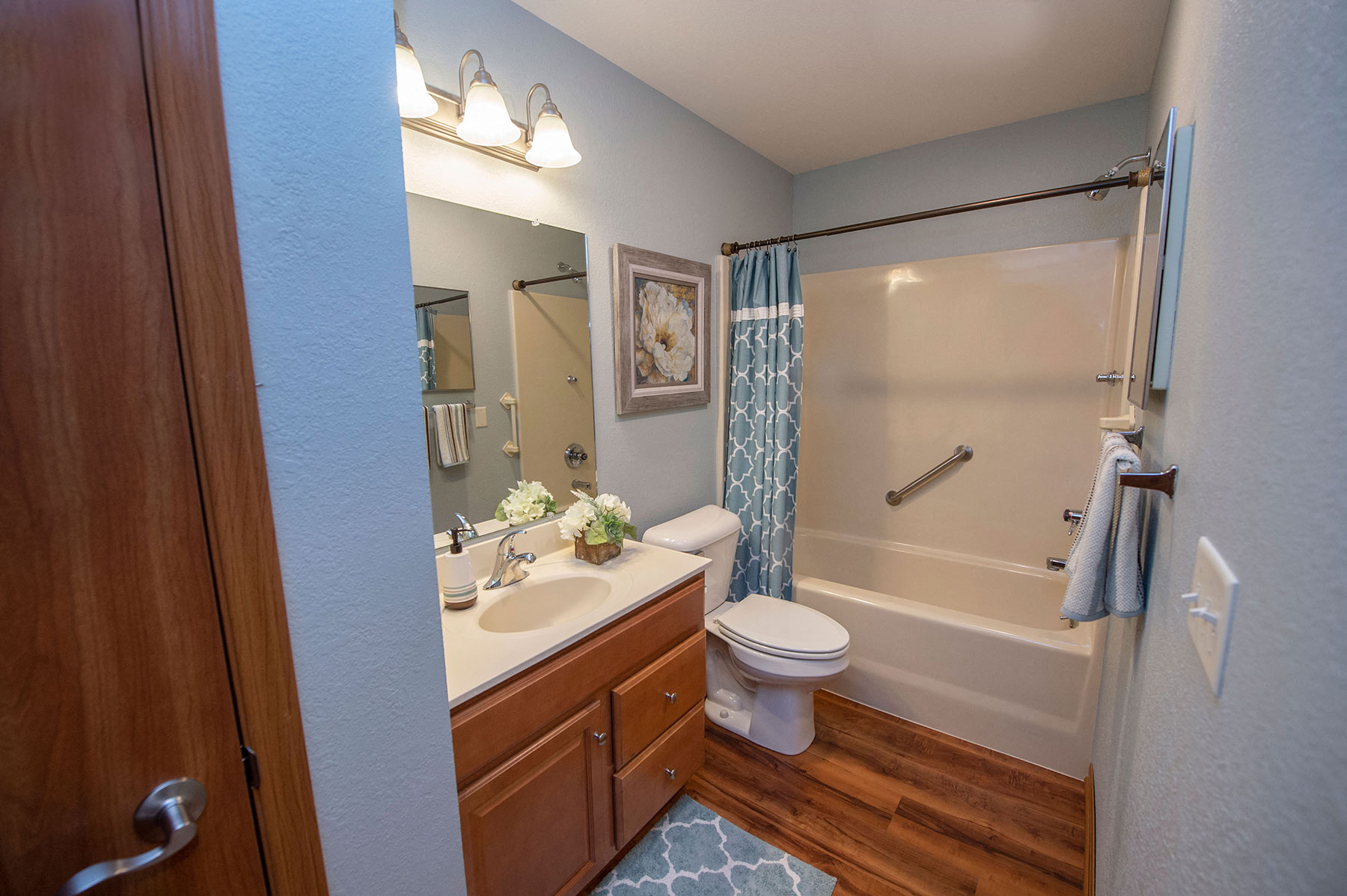 a bathroom with a shower toilet and sink
