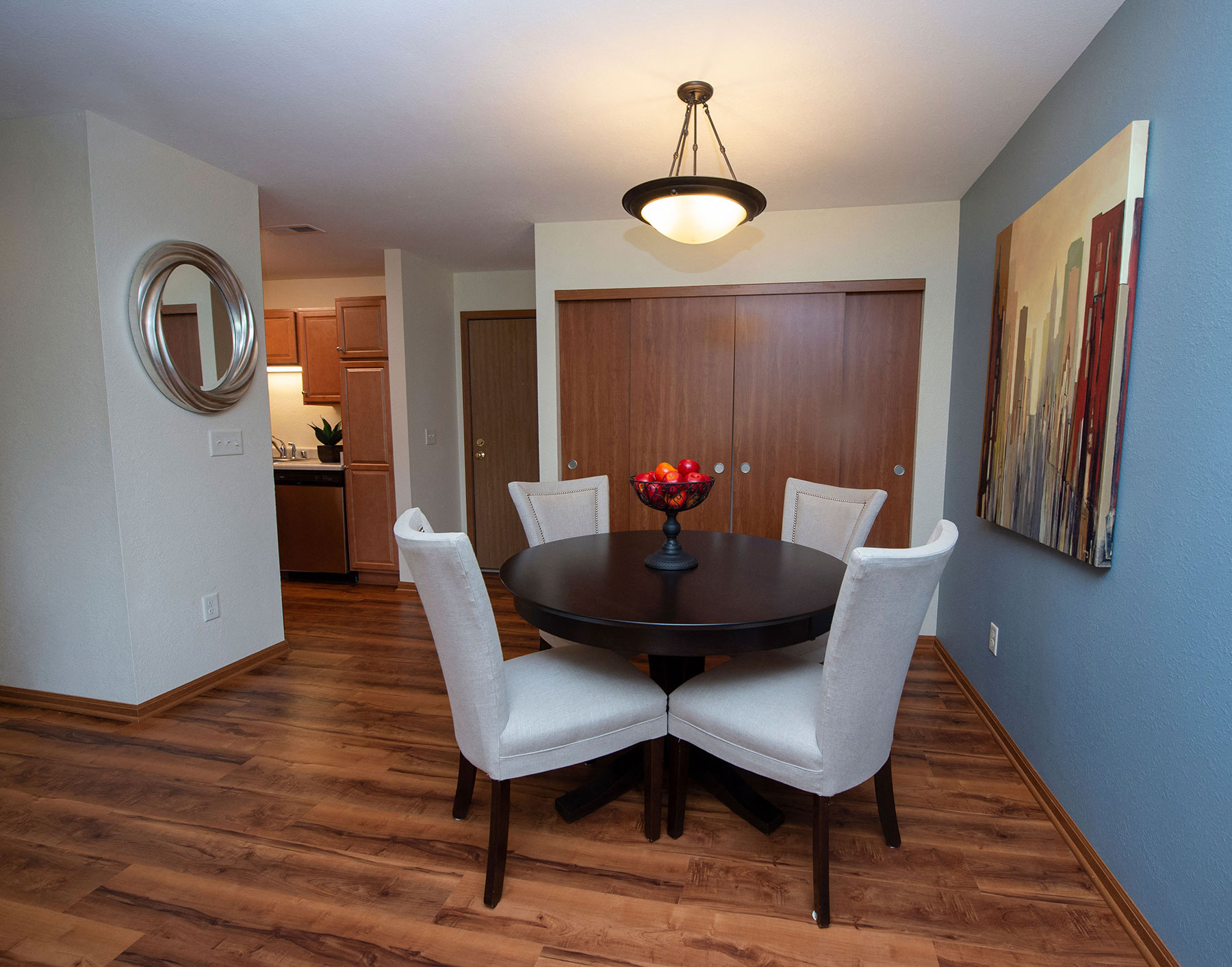 a dining room with a table and chairs
