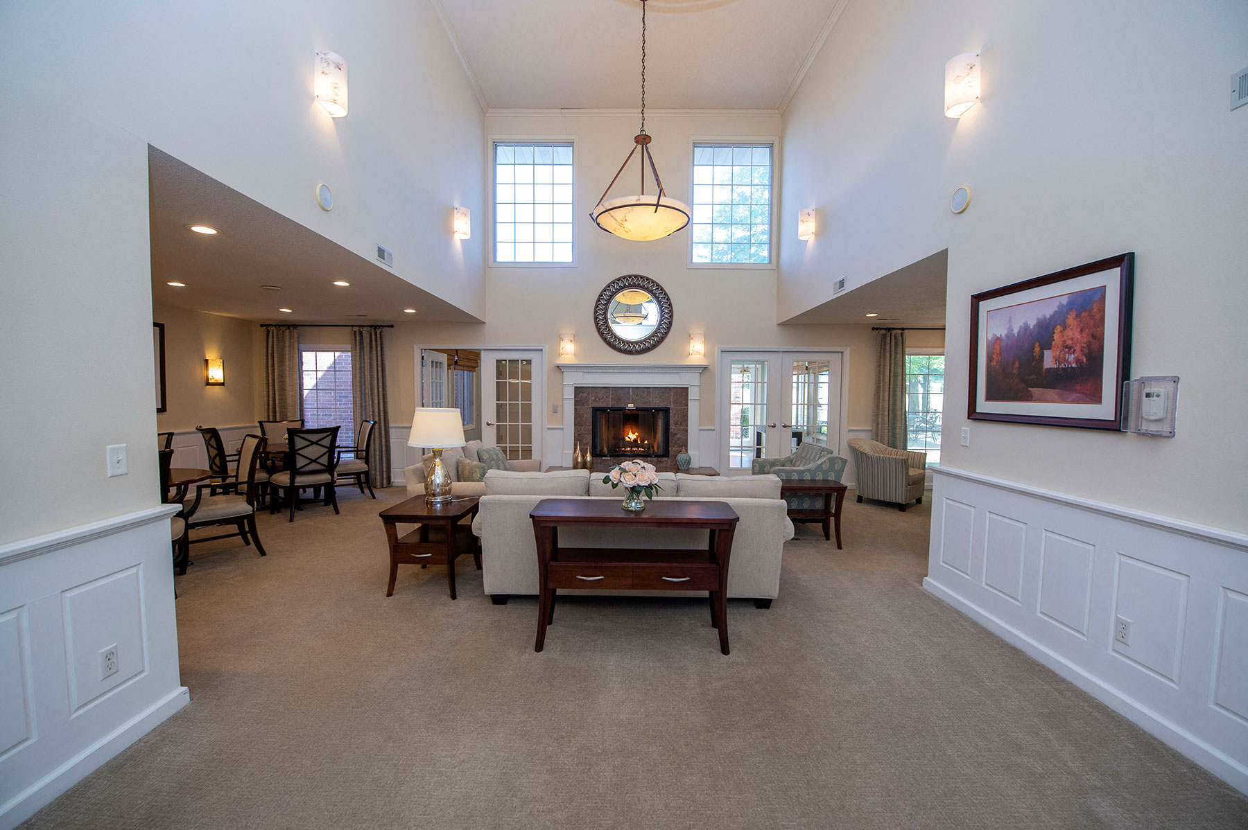 a large living room with a couch and a table
