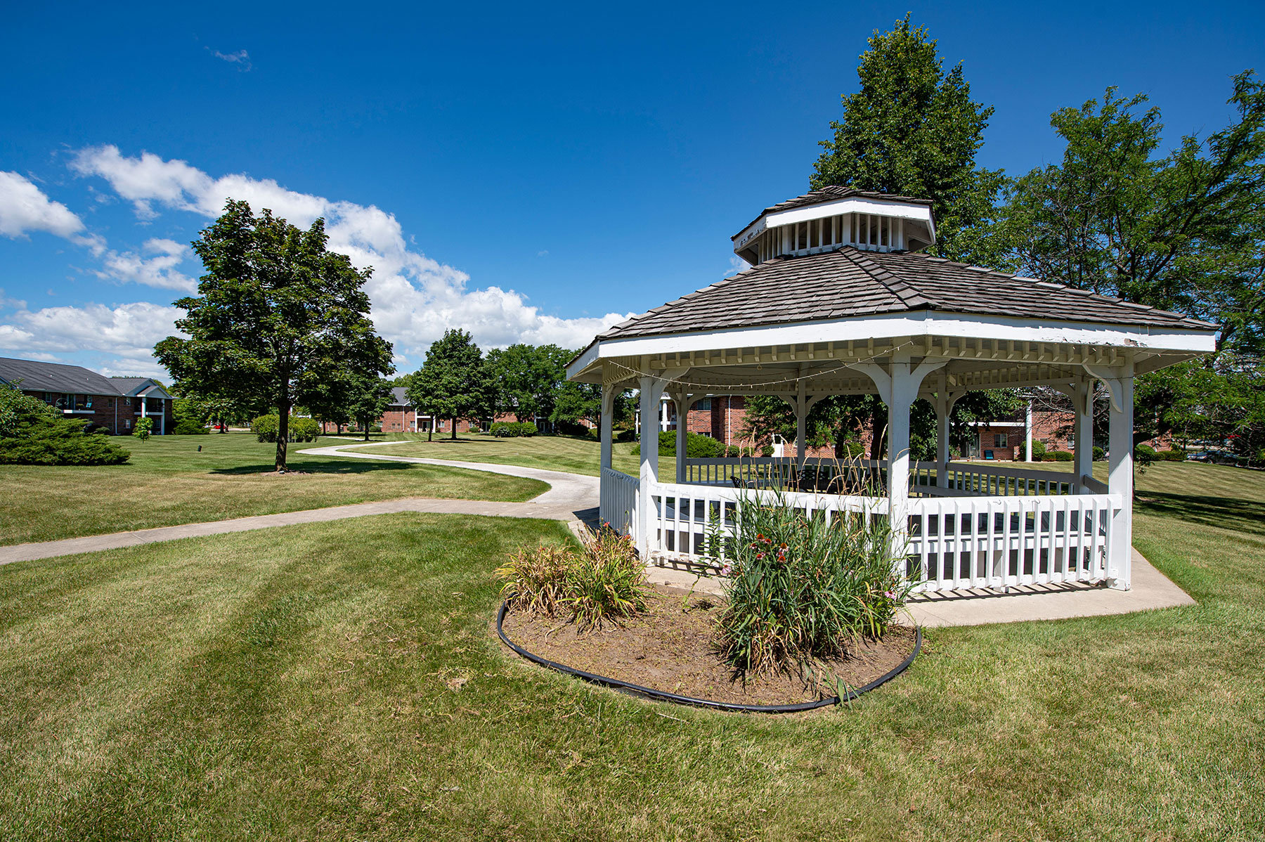 a gazebo in the middle of a park