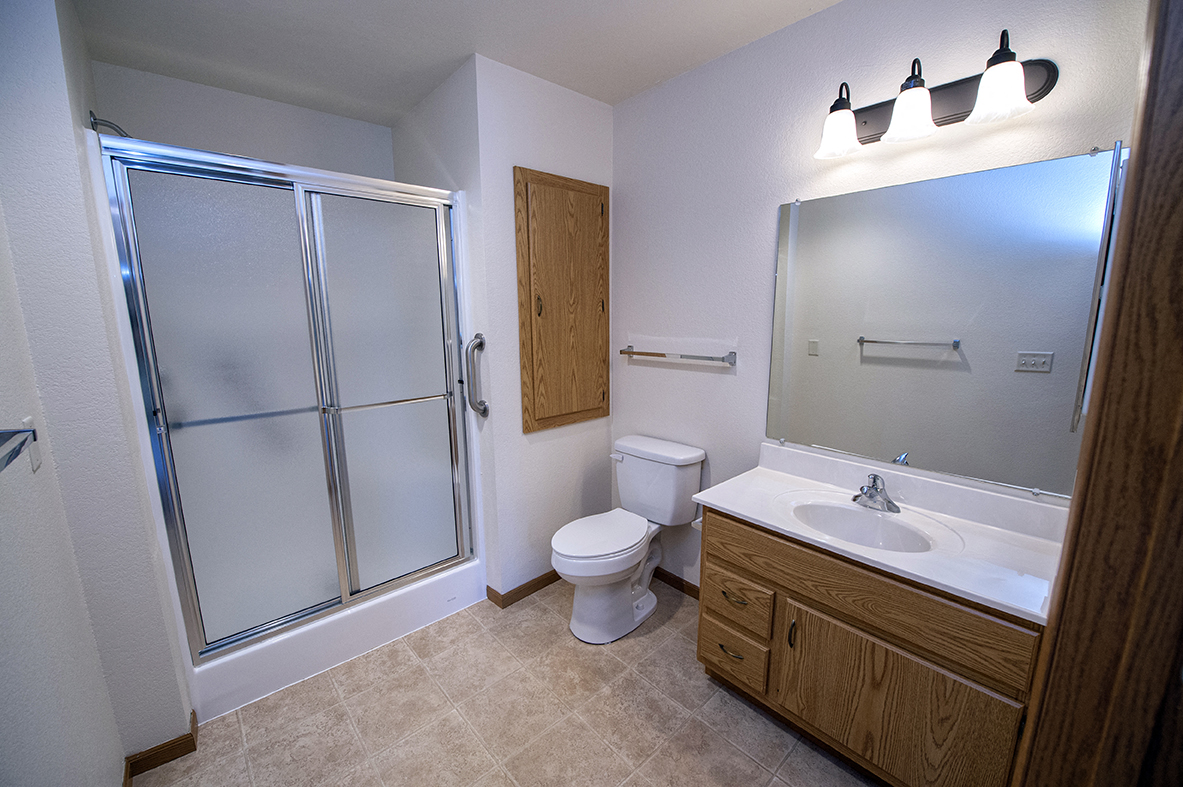 a bathroom with a shower toilet and sink