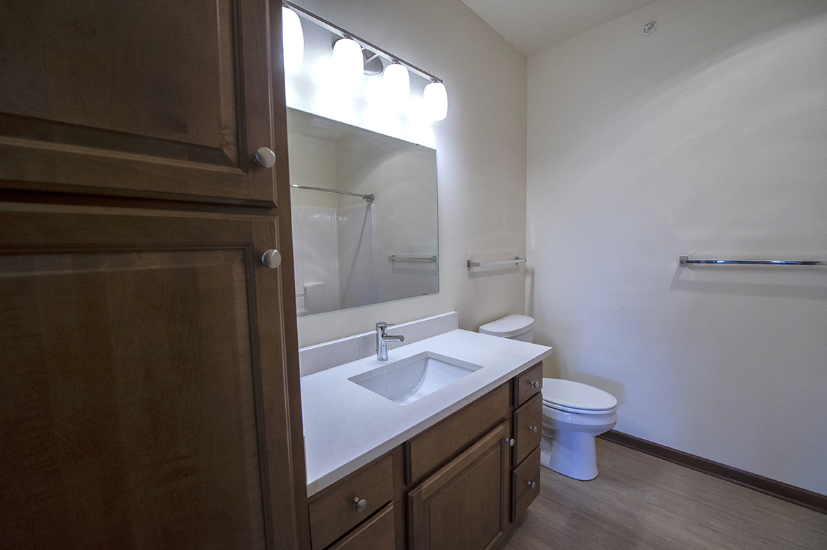 an empty bathroom with a sink and a toilet