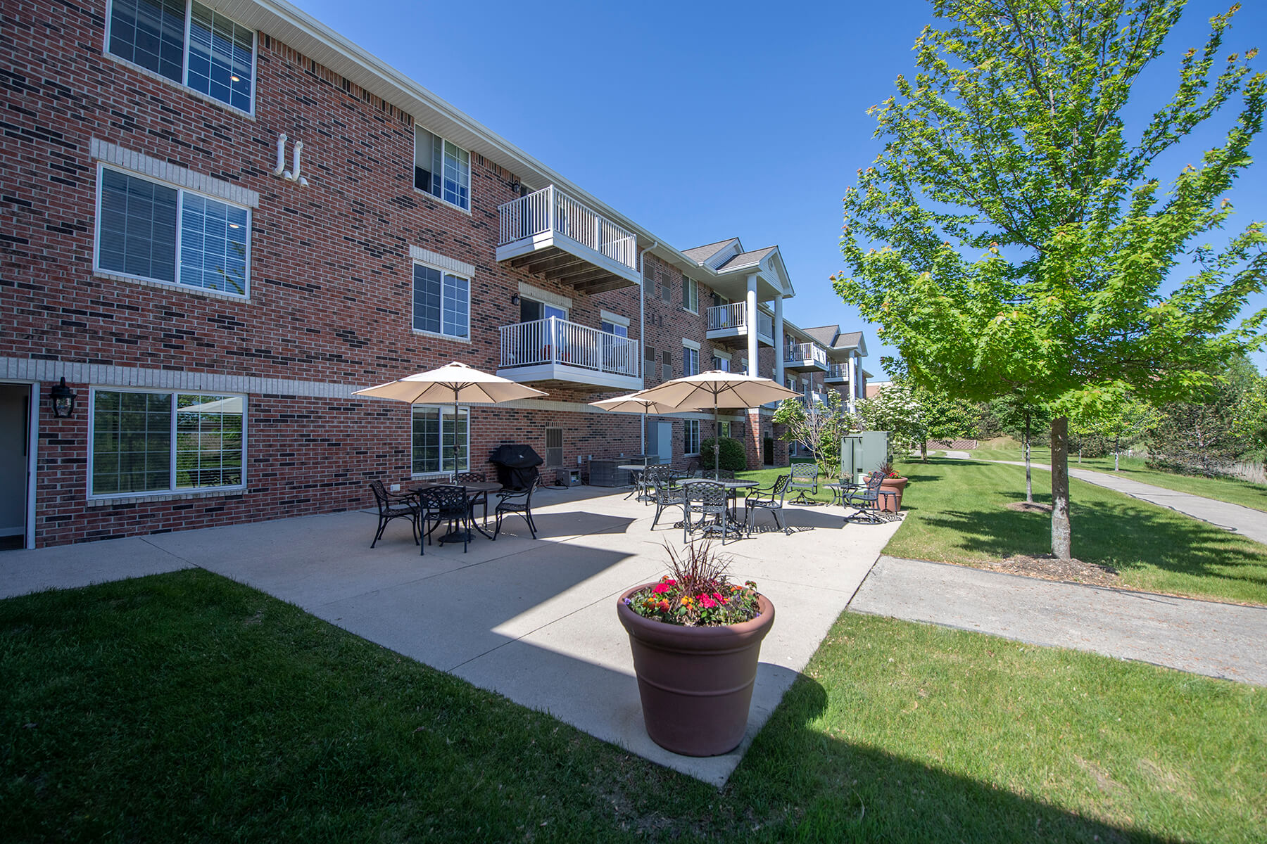 our apartments offer a patio with umbrellas and tables