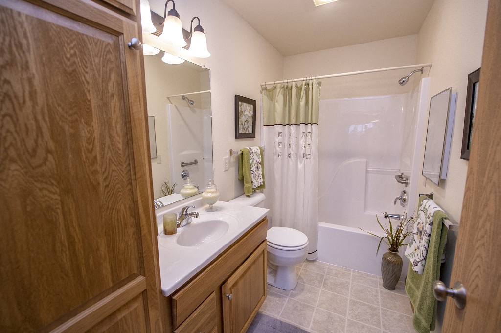 a bathroom with a sink toilet and a shower