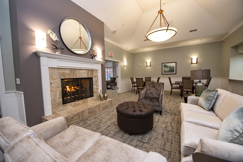 a living room with a fireplace and couches