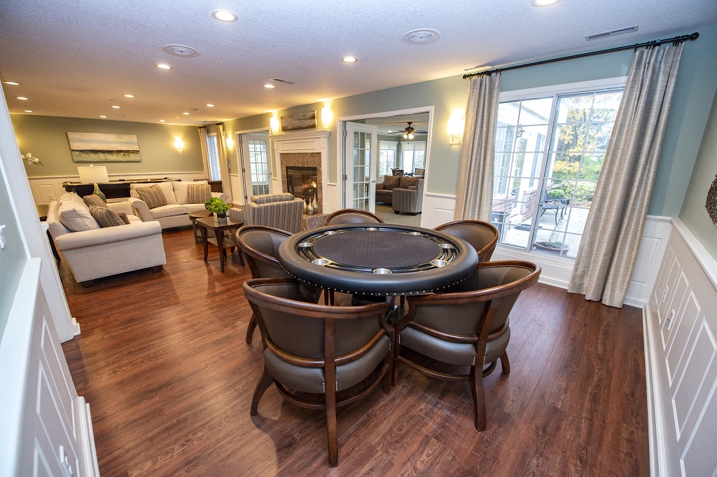a dining room and living room with a table and chairs