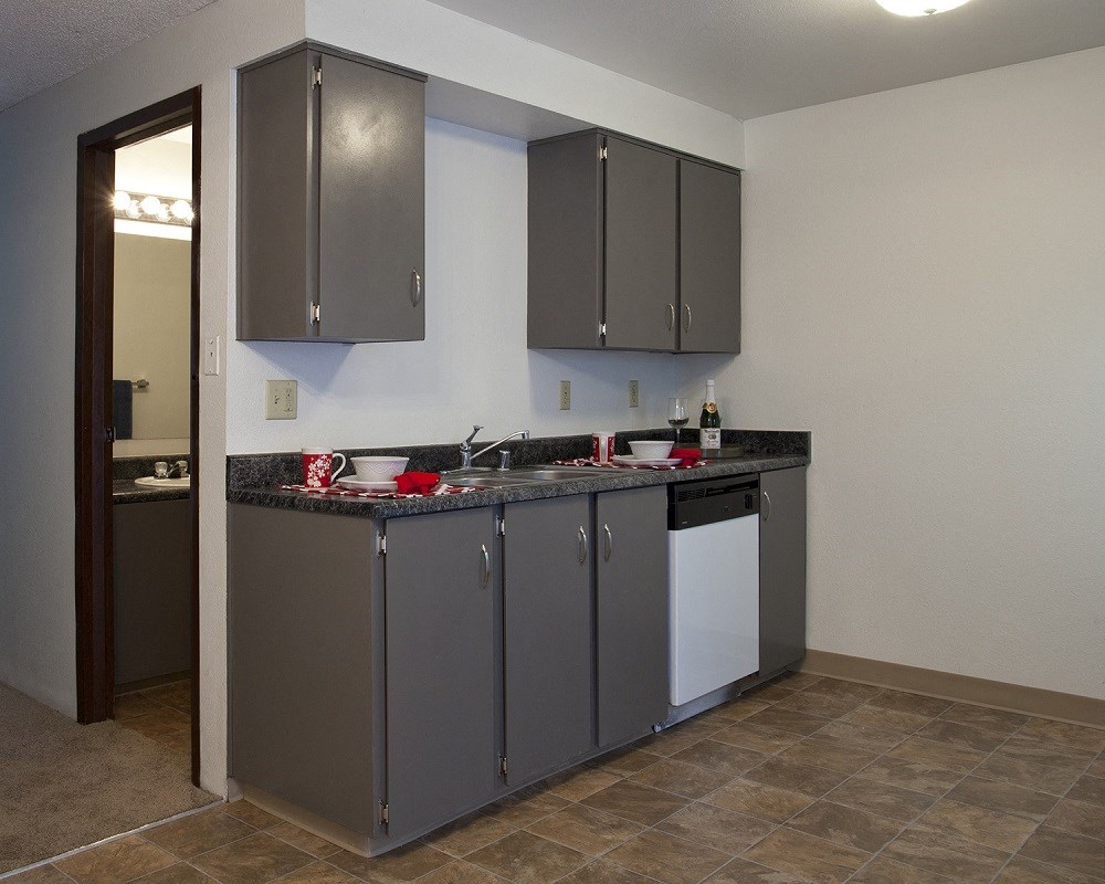Sage Creek Apartments kitchen with grey cabinets