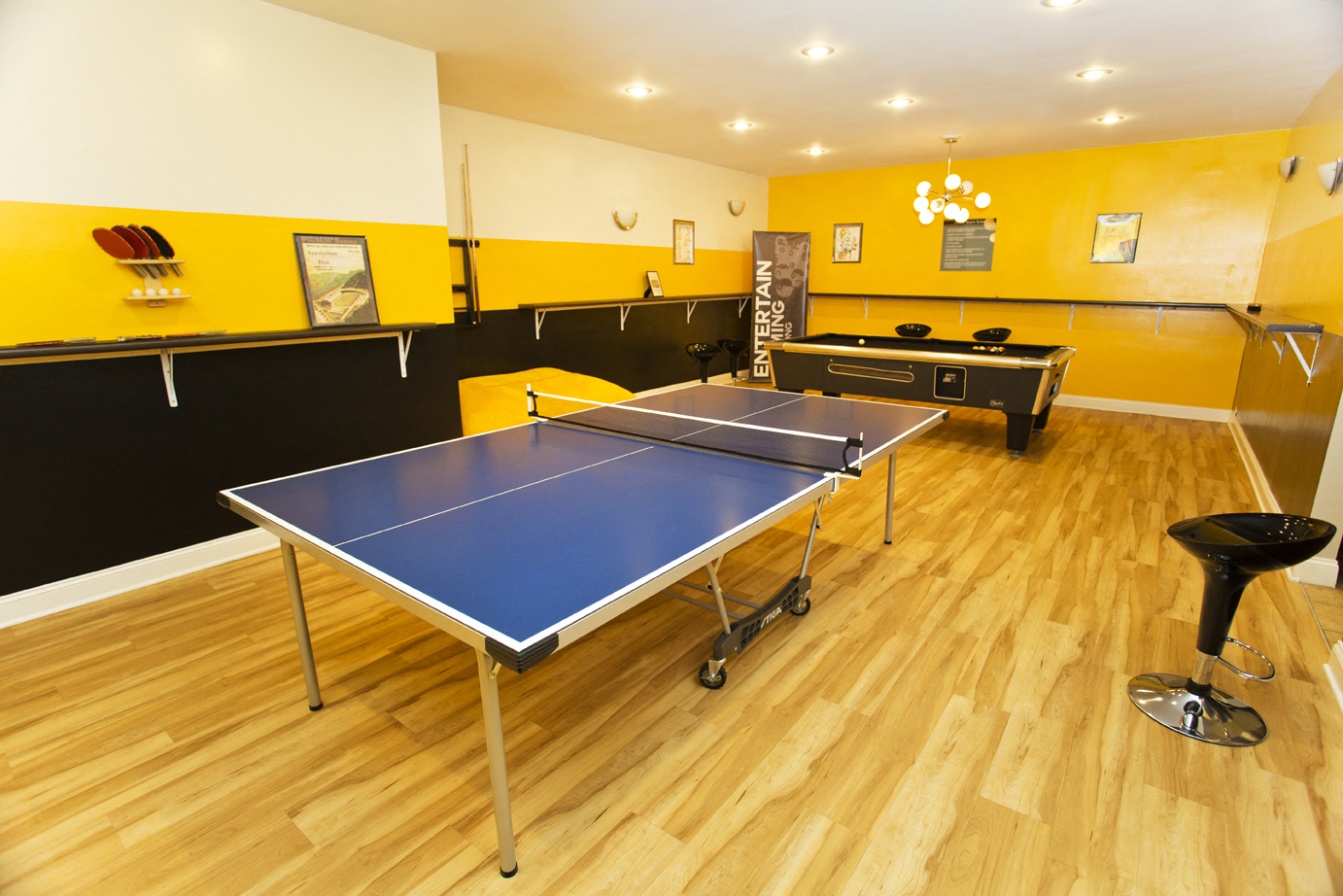 a game room with a ping pong table
