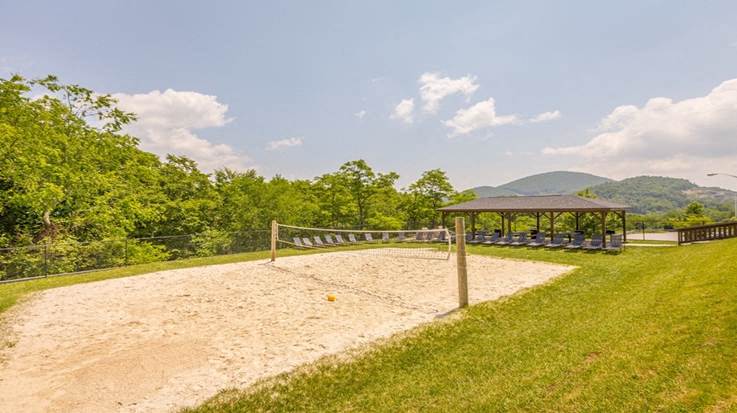 a park with a sandy area and a gazebo