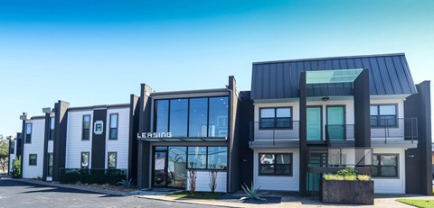 A modern building with the word "LEASING" on the front.