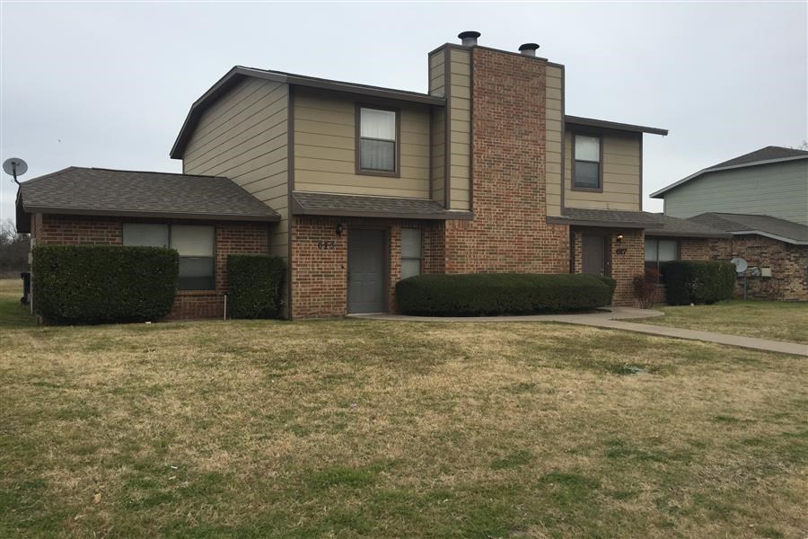 a house with a yard in front of it