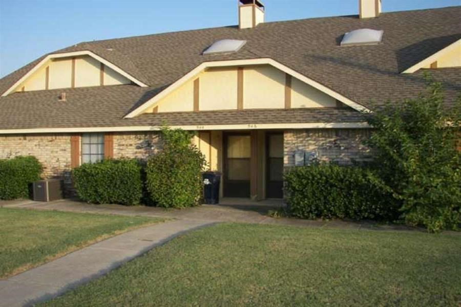 a house with a lawn in front of it