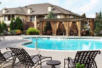 Resort-Style Swimming Pool with Lounge Seating at Best Apartments in Thornton CO
