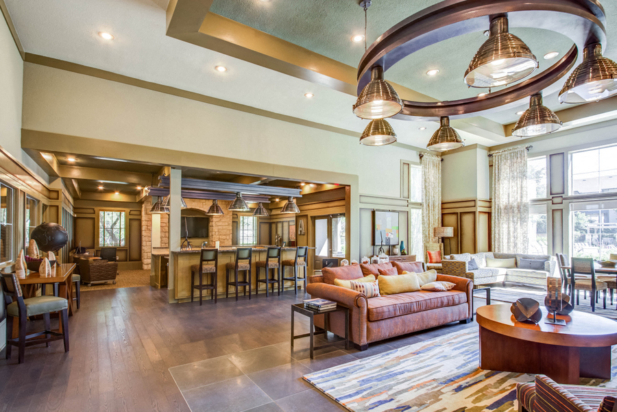 Community lounge over looking the community kitchen and bar seating