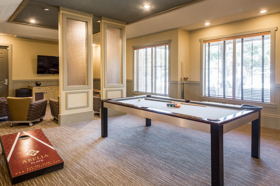 Game Lounge with pool table and corn-hole
