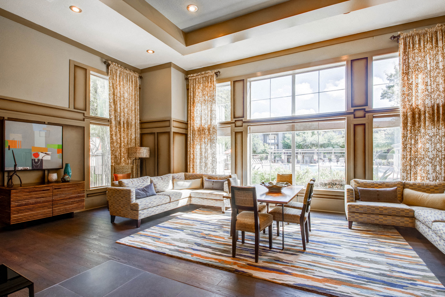 Internet Cafe with couch and table seating in front of floor to ceiling windows with WIFI Hotspot