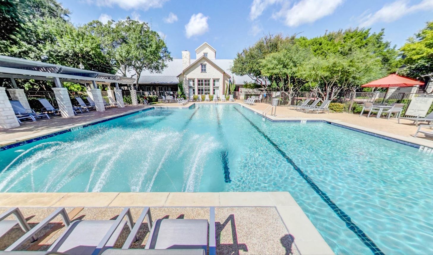 Resort Class Swimming Pool with lap lanes and poolside seating