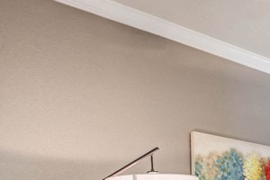 Apartments for Rent in Austin TX - Open Space Living Room with Hardwood Floors, Stylish Interior, and Ceiling Fan Apartments For Rent North Austin - Living Room With Ceiling Fan, Wood-Style Flooring, And Access To Outdoor Patio. - Photo Gallery