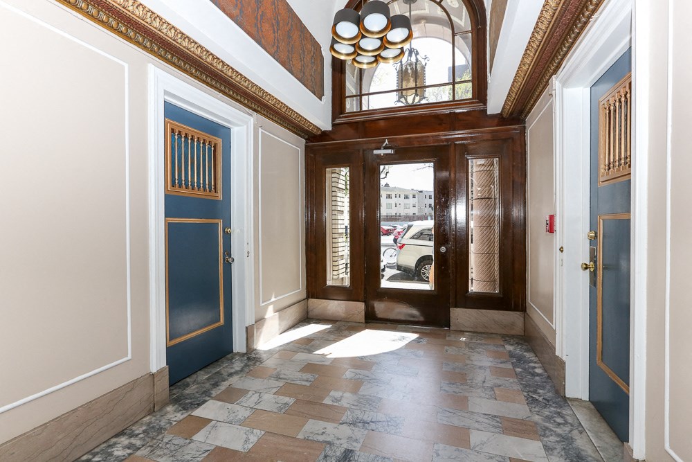 a view of a lobby with a door and a window